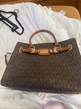 Michael Kors Brown and Tan MK Monogram Satchel along with mini pouch